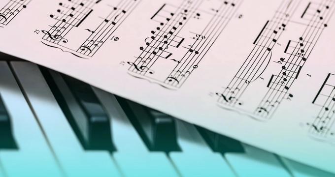 Piano music sheet and piano keys